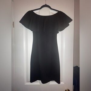 Off the shoulder black dress with draped fabric from Italy.